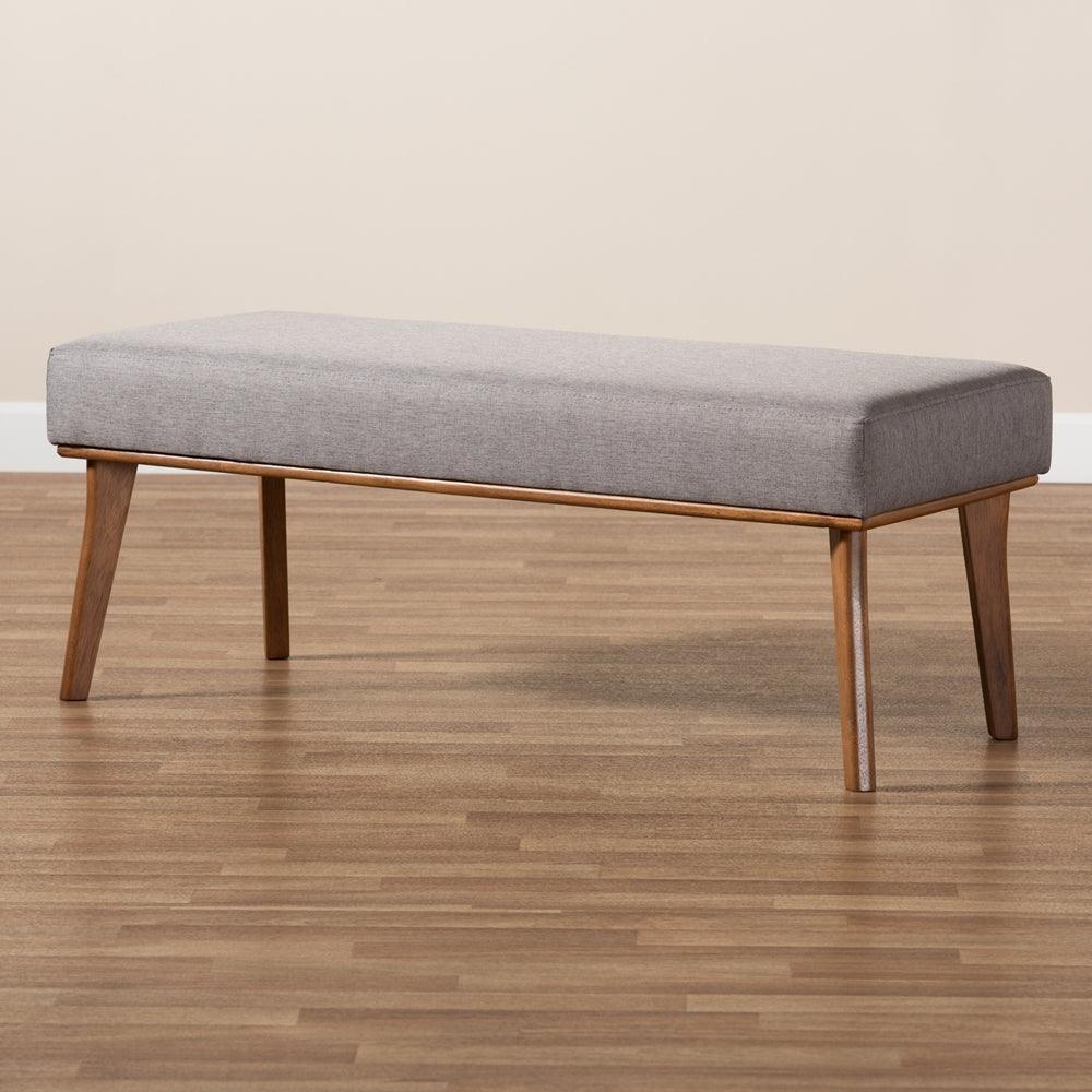 BAXTON STUDIO ODESSA MID-CENTURY MODERN GREY FABRIC UPHOLSTERED AND WALNUT BROWN FINISHED WOOD DINING BENCH